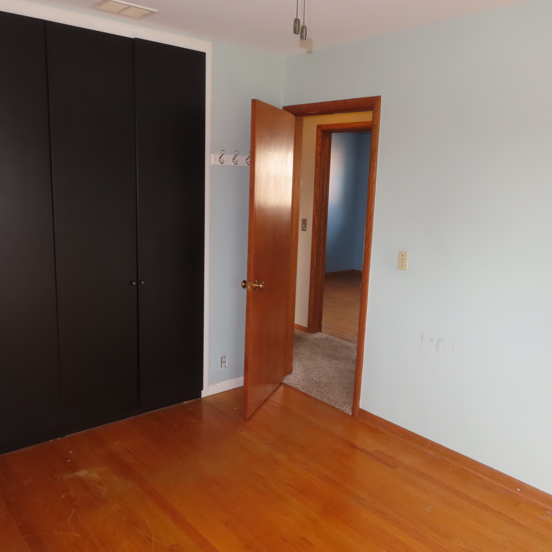 8316 Coral Drive Norridge, IL 60706 - Photo 3 of 42 a view of a hallway with wooden floor