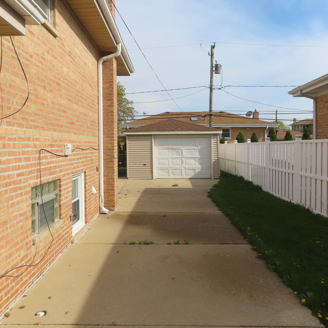 8316 Coral Drive Norridge, IL 60706 - Photo 38 of 42 a front view of a house with a yard
