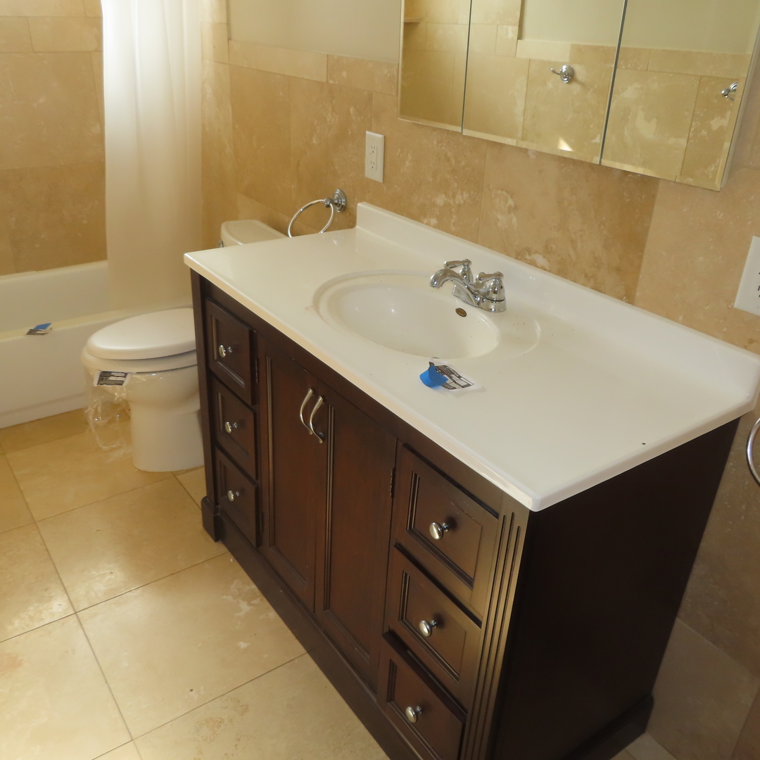8316 Coral Drive Norridge, IL 60706 - Photo 4 of 42 a bathroom with a sink vanity and a toilet