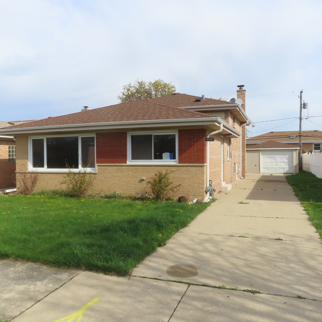 8316 Coral Drive Norridge, IL 60706 - Photo 41 of 42 a front view of a house with a yard