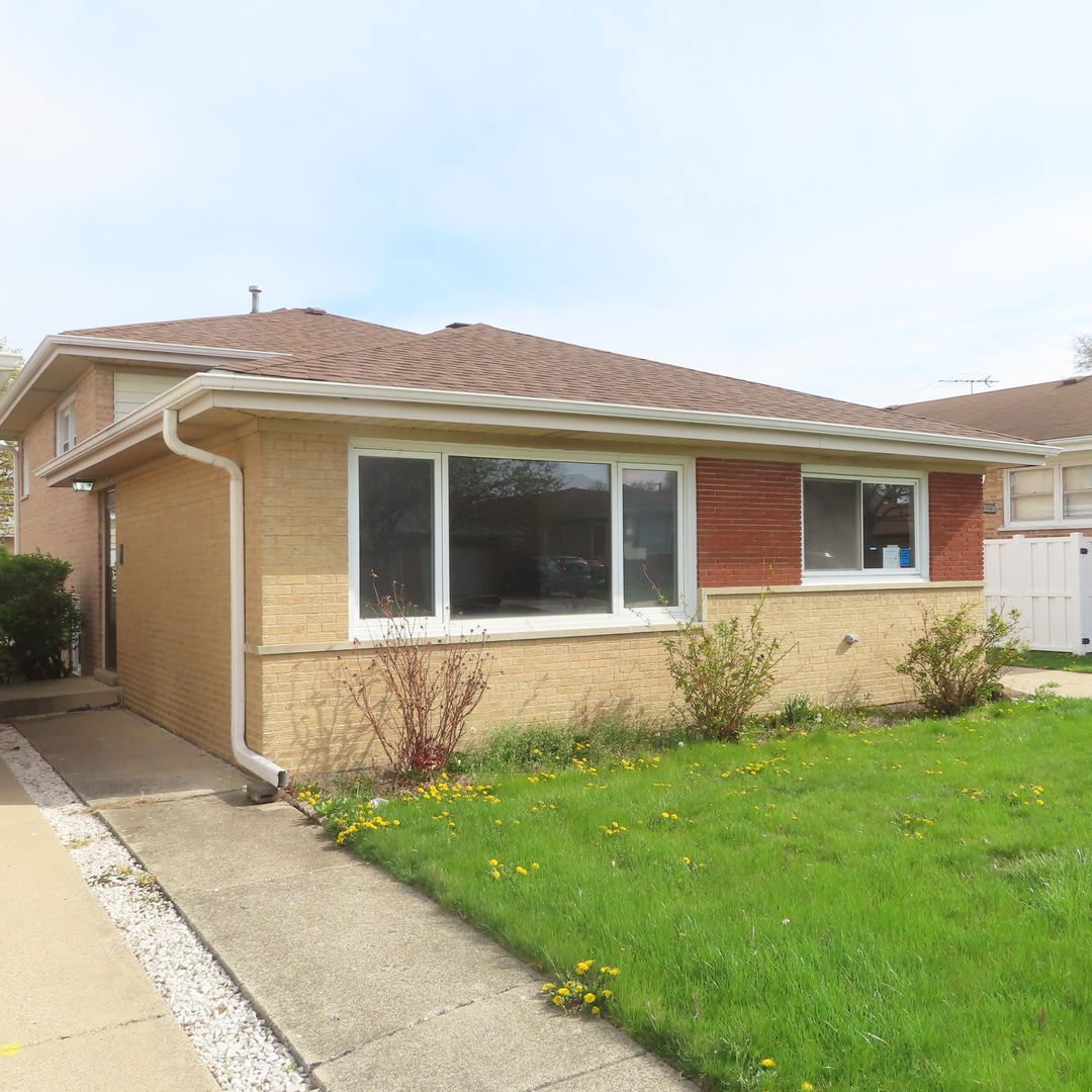 8316 Coral Drive Norridge, IL 60706 - Photo 42 of 42 a front view of a house with garden