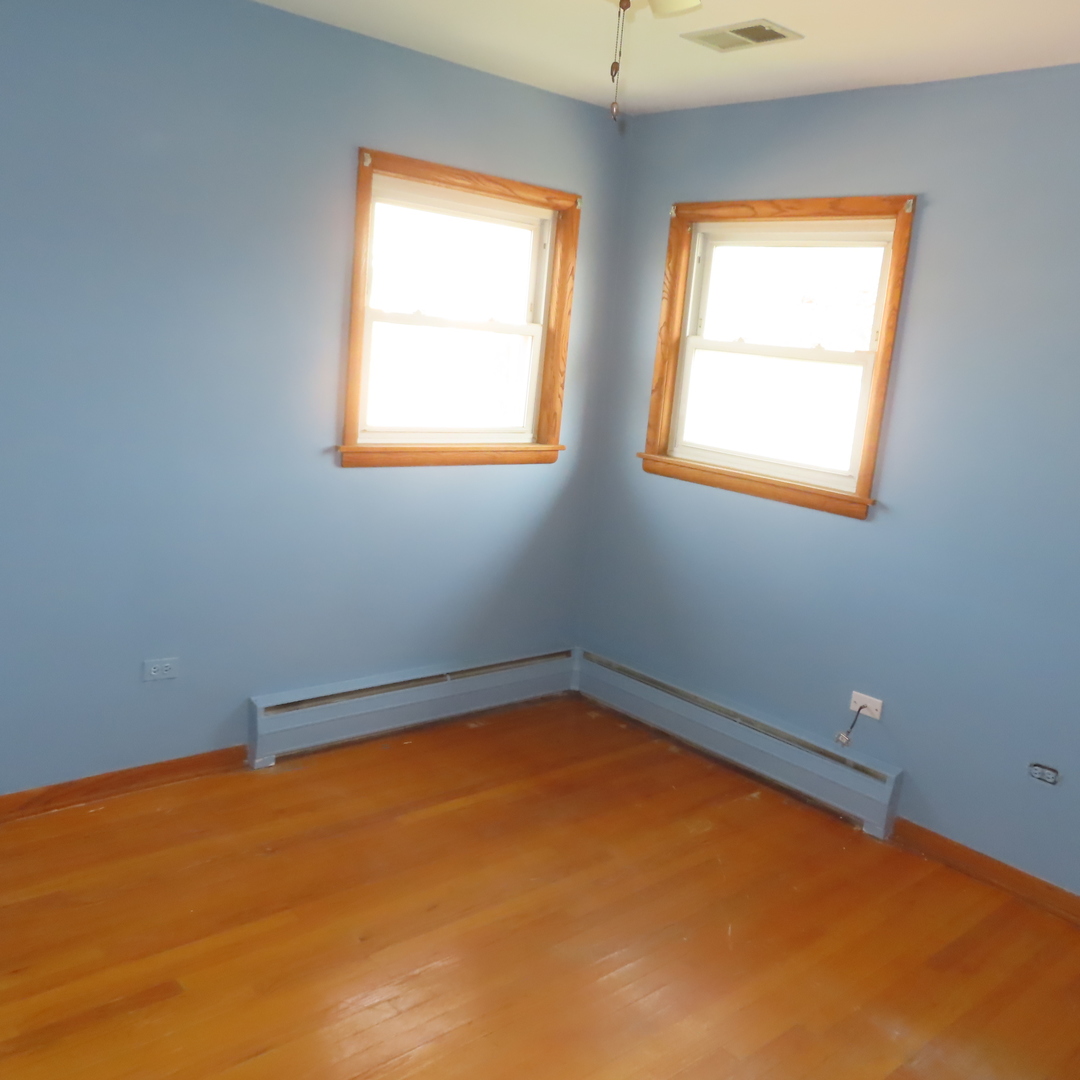 8316 Coral Drive Norridge, IL 60706 - Photo 7 of 42 an empty room with a window