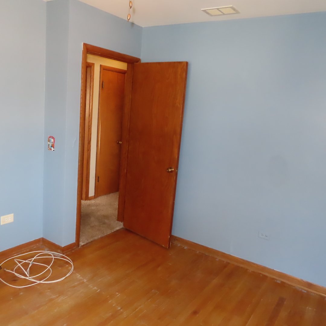 8316 Coral Drive Norridge, IL 60706 - Photo 8 of 42 an empty room with a door