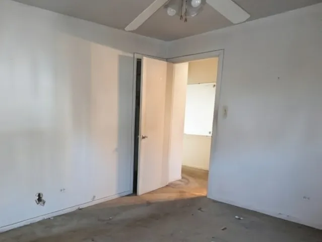 an empty room with a empty space and a window