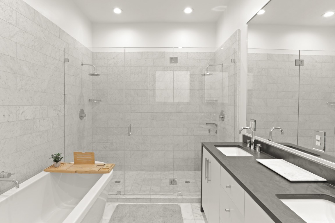 4302 Rose Street Houston, TX 77007 - Photo 14 of 25 a bathroom with a tub sink and mirror
