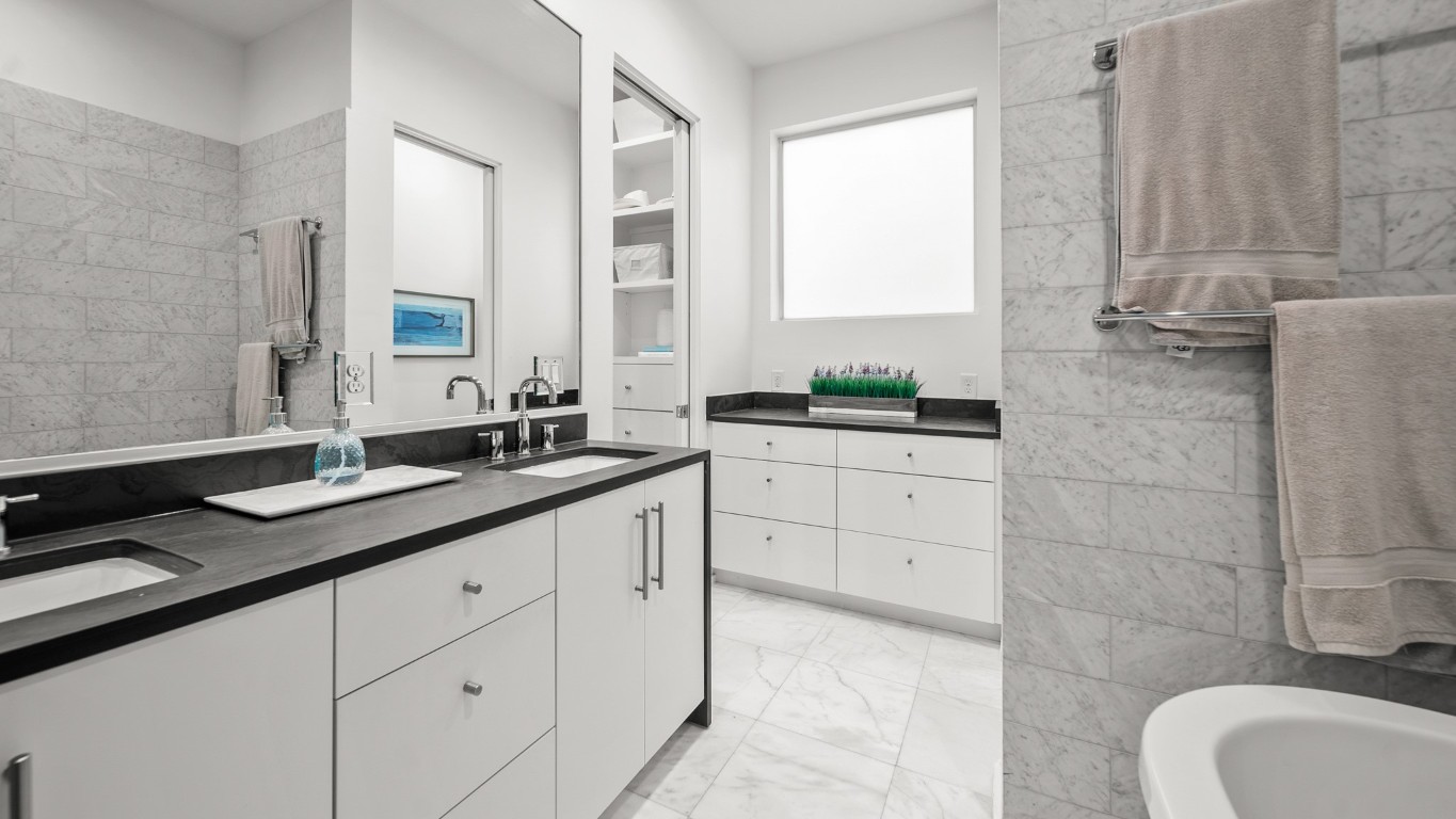 4302 Rose Street Houston, TX 77007 - Photo 15 of 25 a bathroom with a granite countertop sink a mirror and a