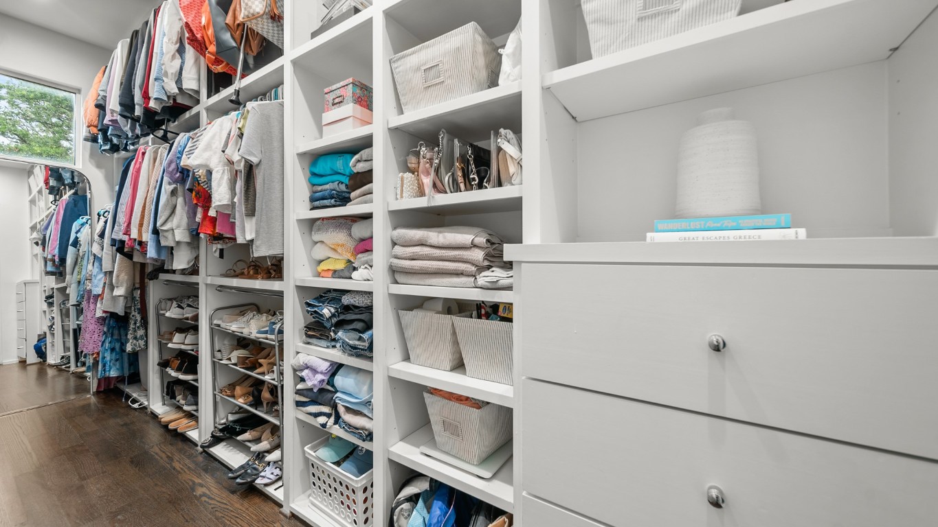 4302 Rose Street Houston, TX 77007 - Photo 16 of 25 a view of walk in closet with clothes and shoes