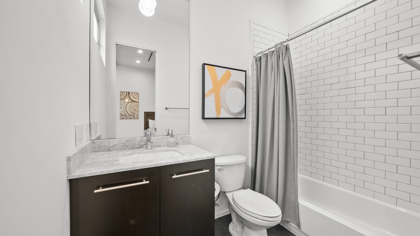 4302 Rose Street Houston, TX 77007 - Photo 19 of 25 a bathroom with a sink a toilet and shower