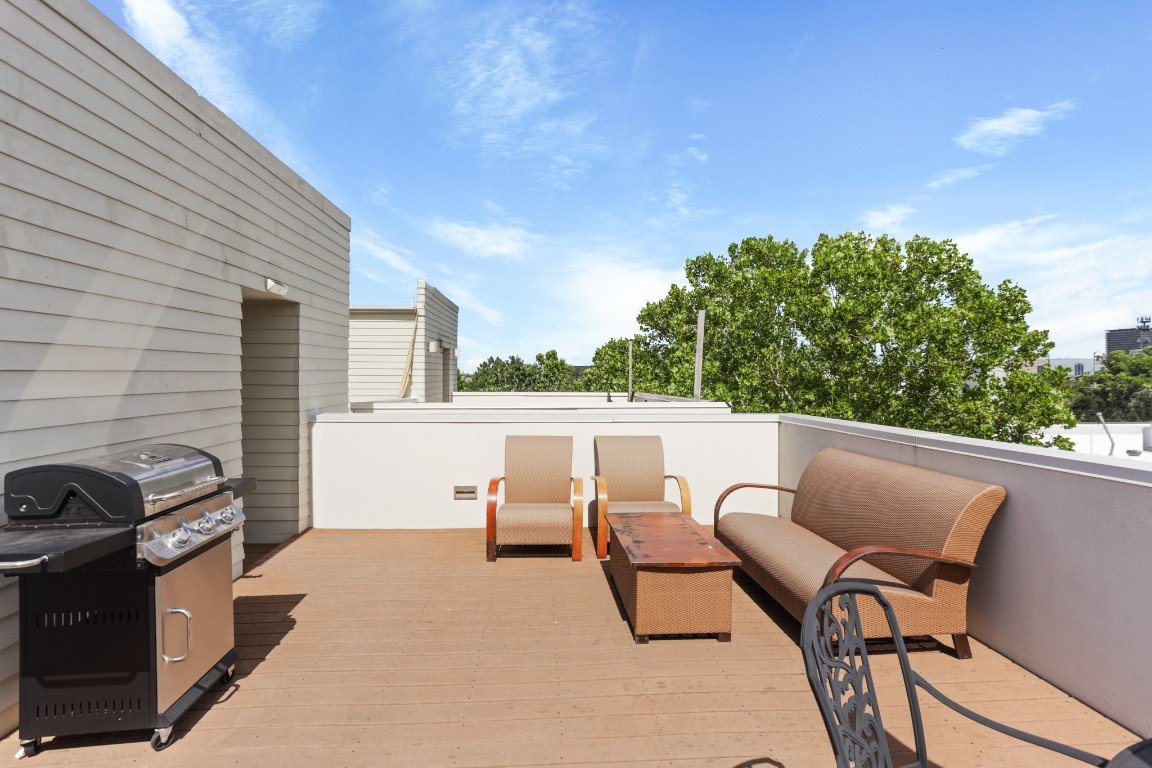 4302 Rose Street Houston, TX 77007 - Photo 25 of 25 a view of a patio with table and chairs with wooden floor and fence