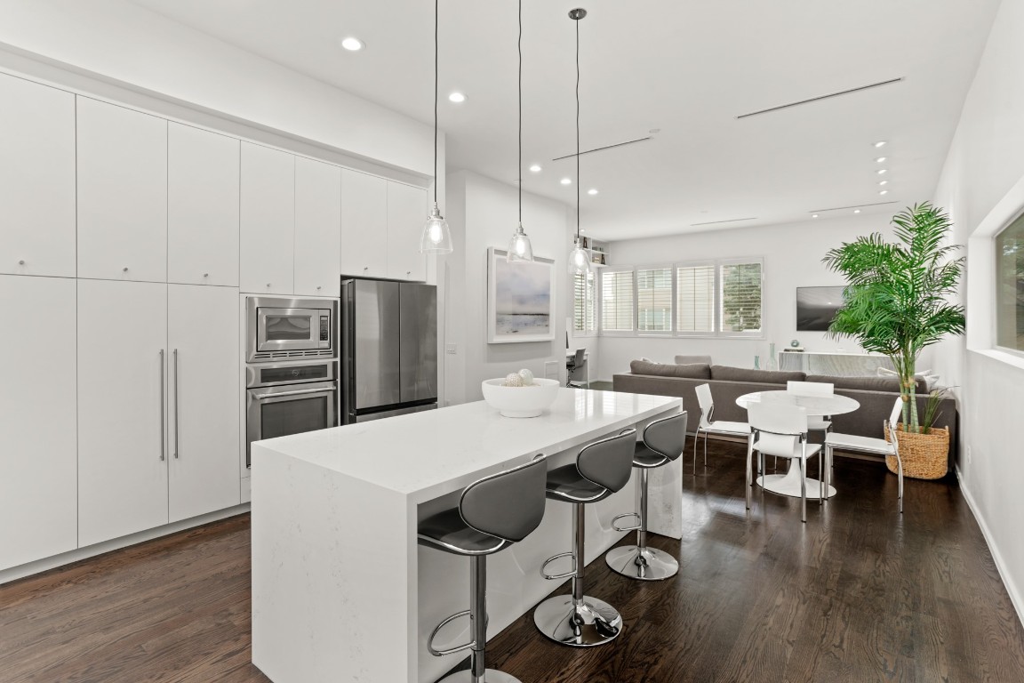 4302 Rose Street Houston, TX 77007 - Photo 3 of 25 a large kitchen with a table and chairs