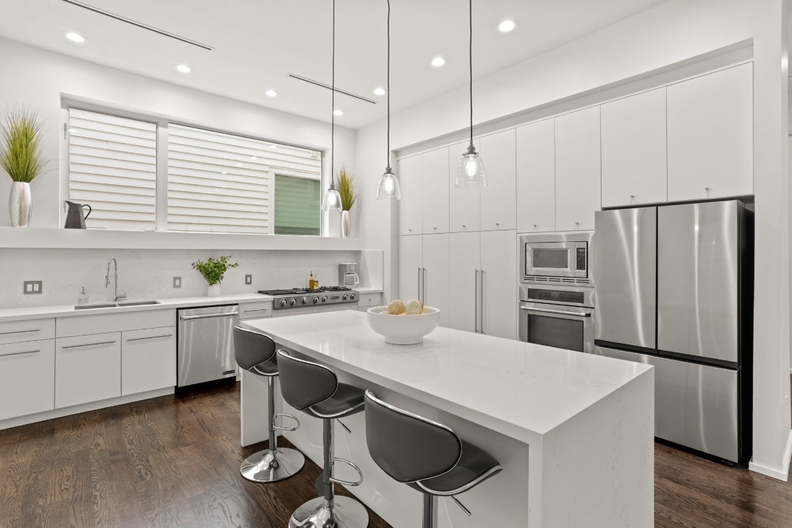 4302 Rose Street Houston, TX 77007 - Photo 4 of 25 a kitchen with appliances cabinets and furniture