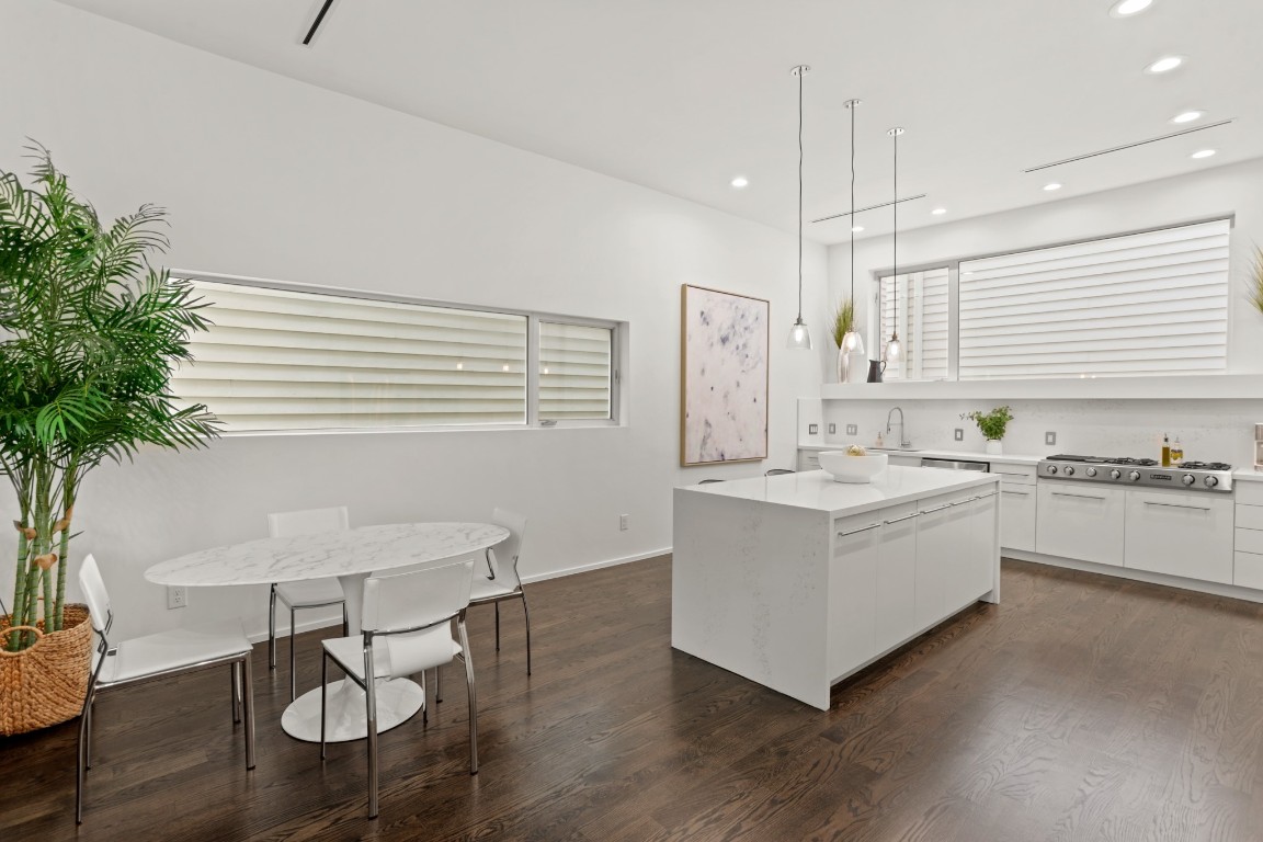 4302 Rose Street Houston, TX 77007 - Photo 6 of 25 a kitchen with a sink cabinets and wooden floor