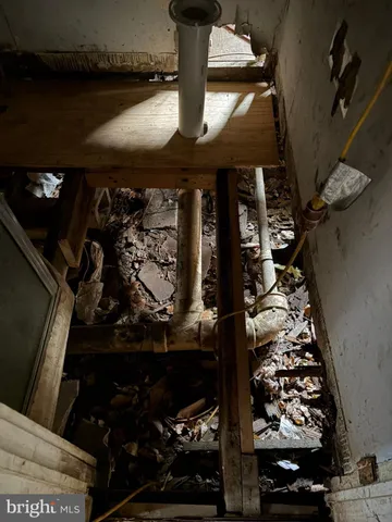 a backyard of a house with large trees