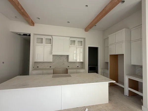a view of a big room with windows and cabinet