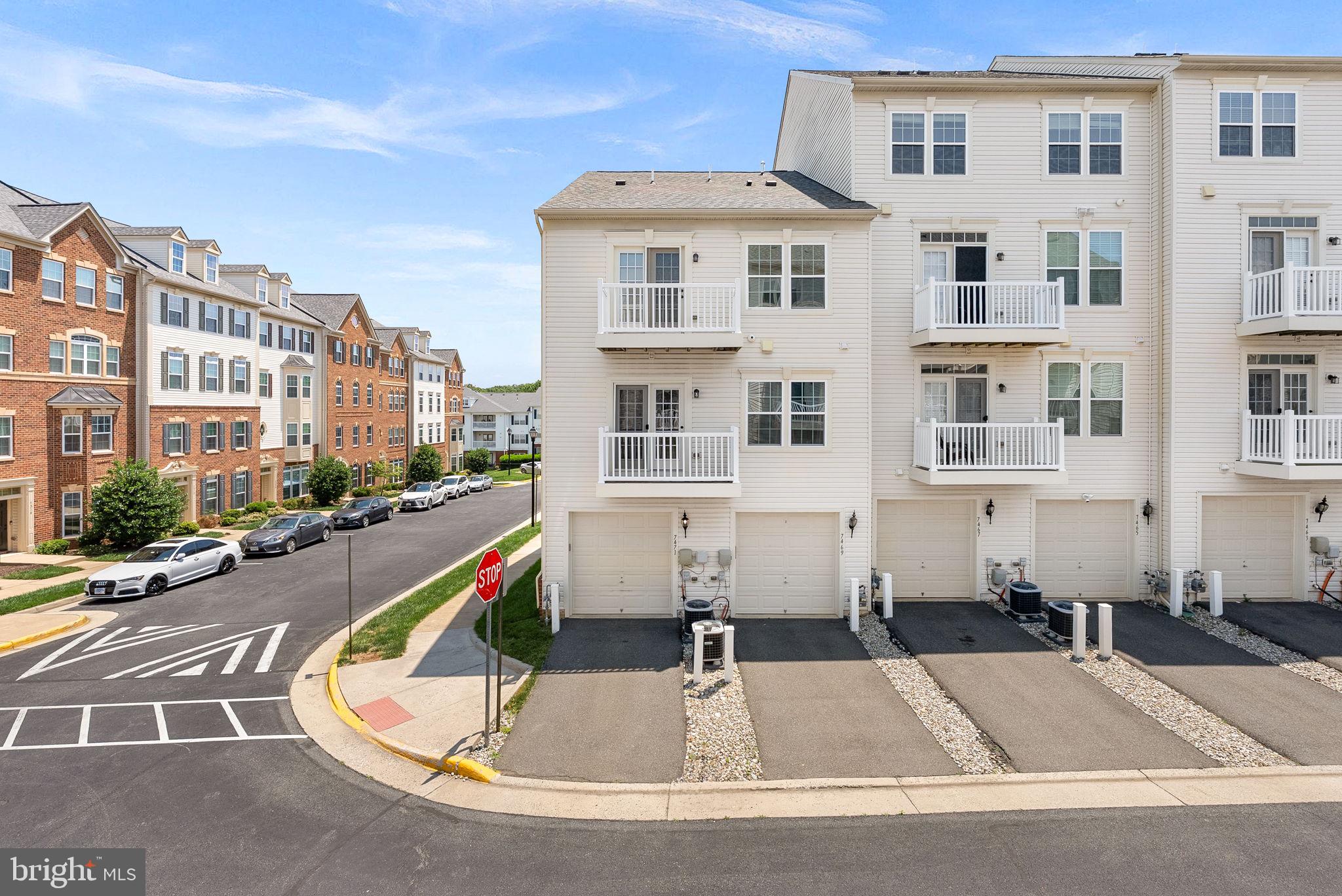 7471 Brunson Circle, Unit 10A Gainesville, VA 20155 - Photo 24 of 30 a view of a building with a swimming pool