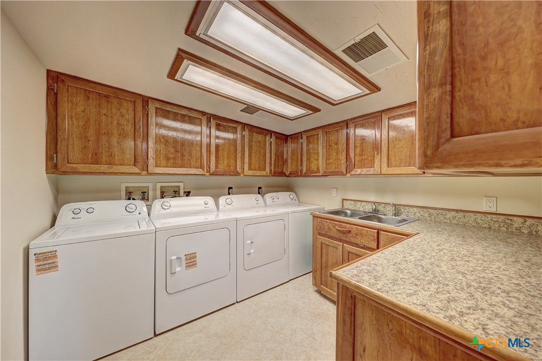 210 Center Point Drive Center Point, TX 78010 - Photo 39 of 44 Laundry room double new appliances custom cabinets made from Cherry wood
