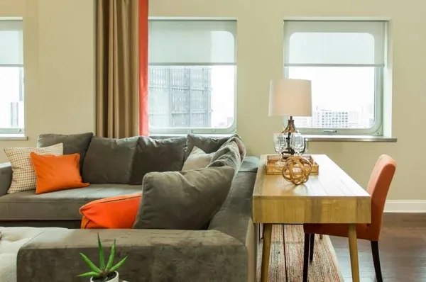 a living room with furniture and a window