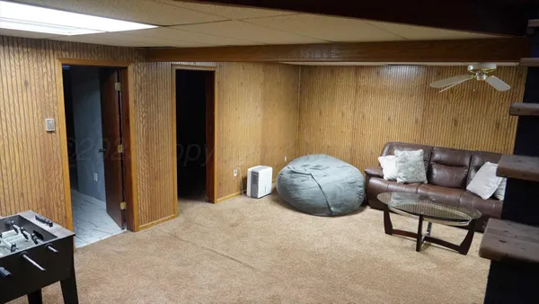 a bedroom with a bed and a chair