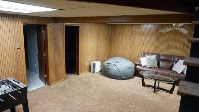 a bedroom with a bed and a chair