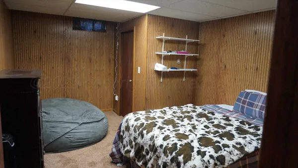 a bedroom with a bed and a cabinets