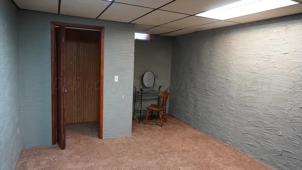 a view of a livingroom with chairs