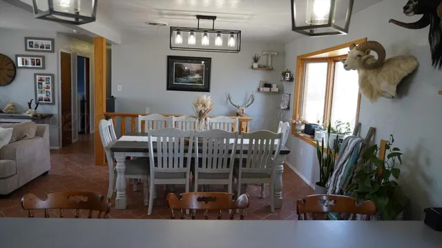 a bedroom with furniture and a window