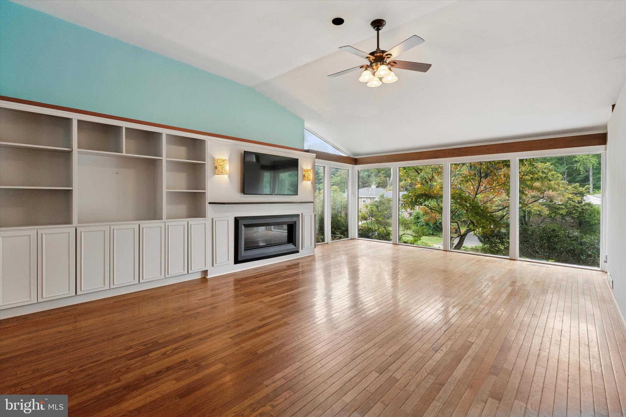990 Indian Creek Road Jenkintown, PA 19046 - Photo 2 of 58 a view of an empty room with a fireplace and a window