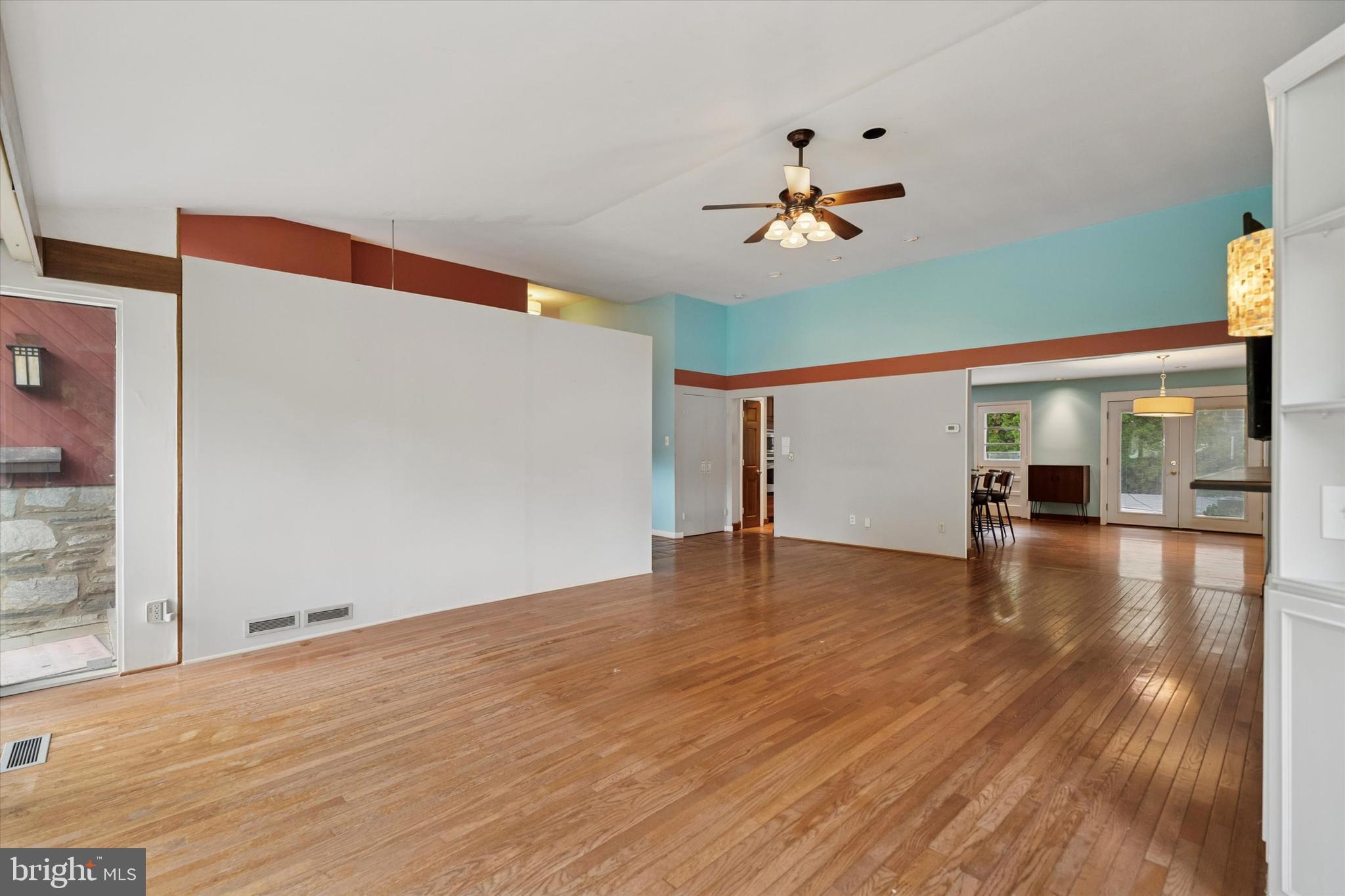 990 Indian Creek Road Jenkintown, PA 19046 - Photo 3 of 58 a view of empty room with wooden floor and fan