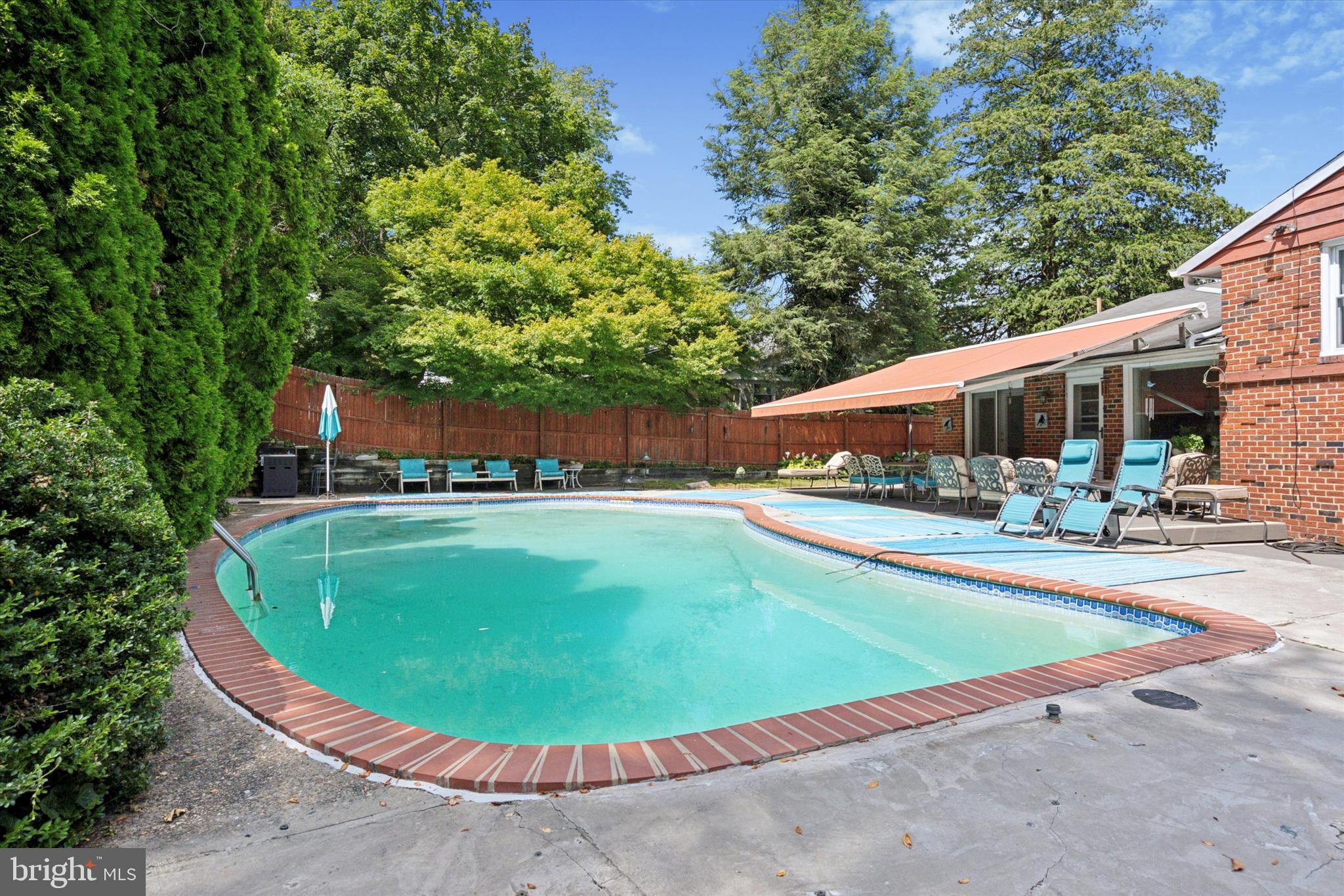 990 Indian Creek Road Jenkintown, PA 19046 - Photo 44 of 58 a view of a swimming pool with a patio