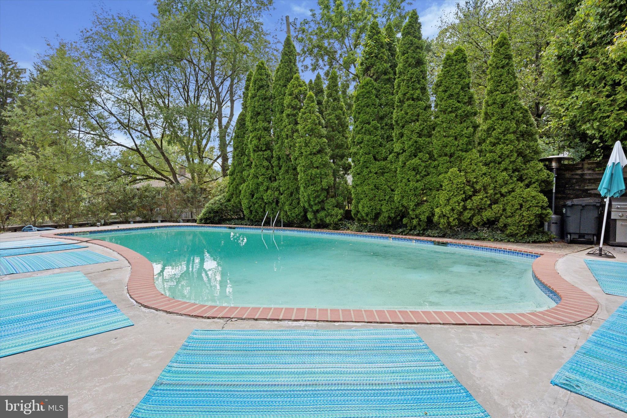 990 Indian Creek Road Jenkintown, PA 19046 - Photo 45 of 58 a view of a swimming pool with a yard