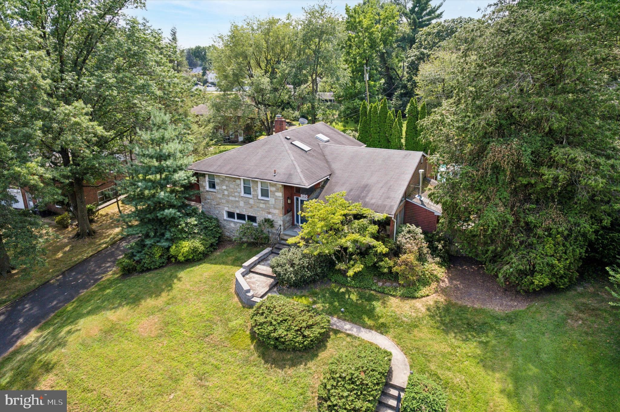 990 Indian Creek Road Jenkintown, PA 19046 - Photo 52 of 58 a aerial view of a house with a yard and garden
