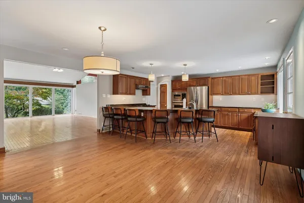 a view of a kitchen and dining room