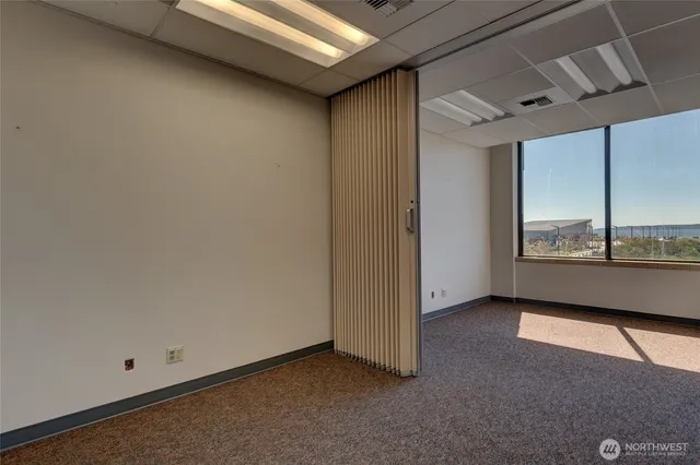 a view of an empty room with a window
