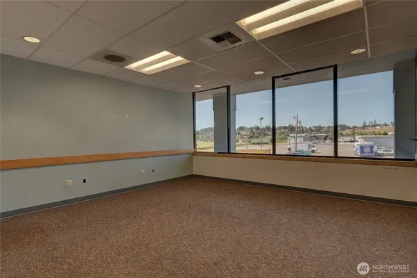 a view of an empty room with a window