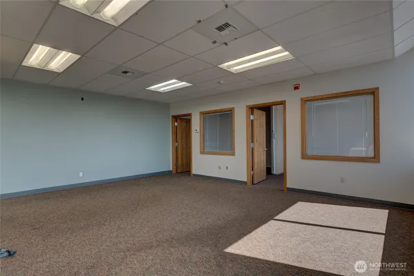 a view of an empty room with a window