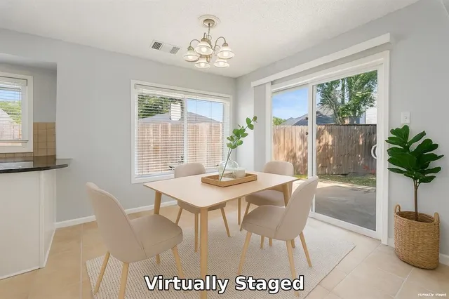 a view of a dining room with furniture window and outside view
