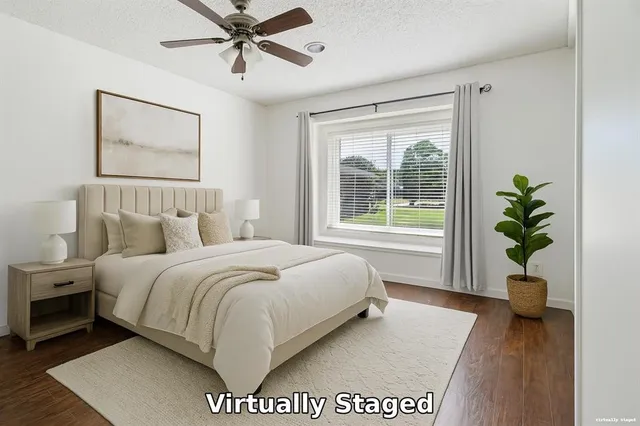 a bed sitting in a bedroom next to a window