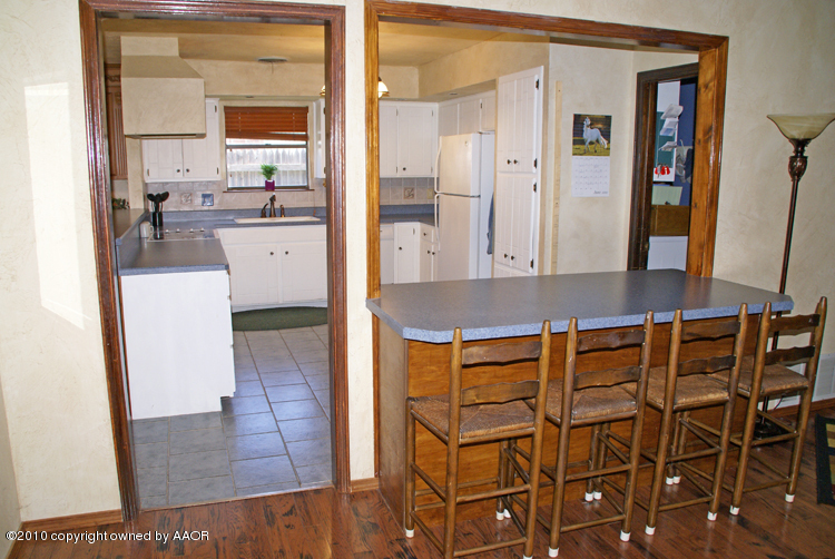 8302 Ranier Drive Amarillo, TX 79110 - Photo 11 of 32 a view of a kitchen and an entryway