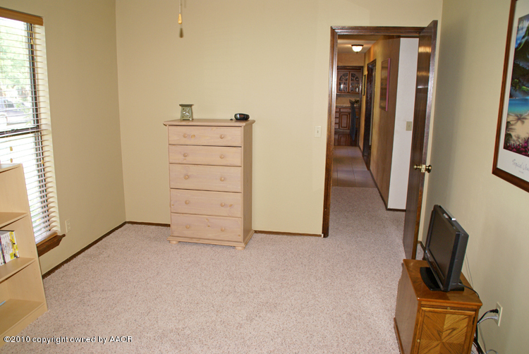 8302 Ranier Drive Amarillo, TX 79110 - Photo 23 of 32 an empty room with a door
