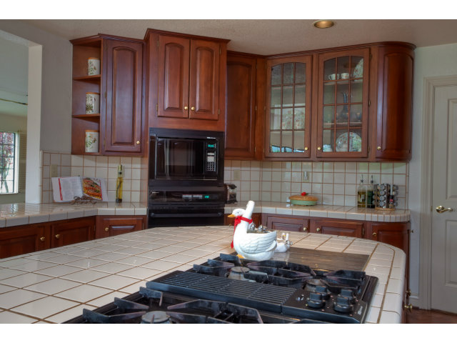 1151 Sunshine Valley Road Montara, CA 94037 - Photo 12 of 23 a kitchen with a sink dishwasher stove and cabinets
