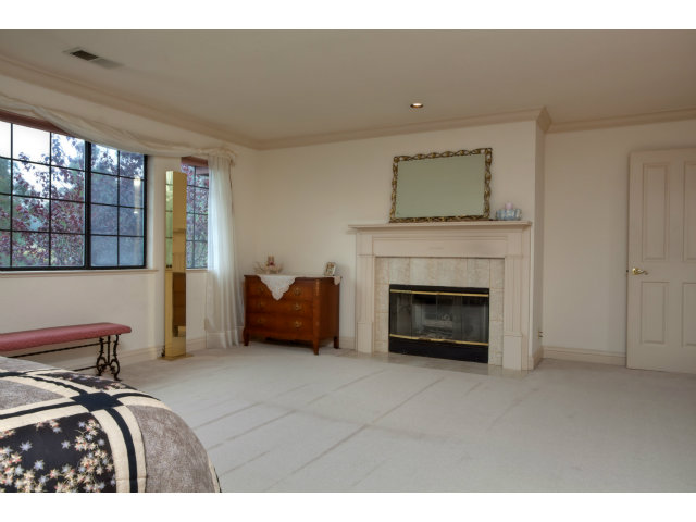 1151 Sunshine Valley Road Montara, CA 94037 - Photo 15 of 23 a living room with furniture and a fireplace