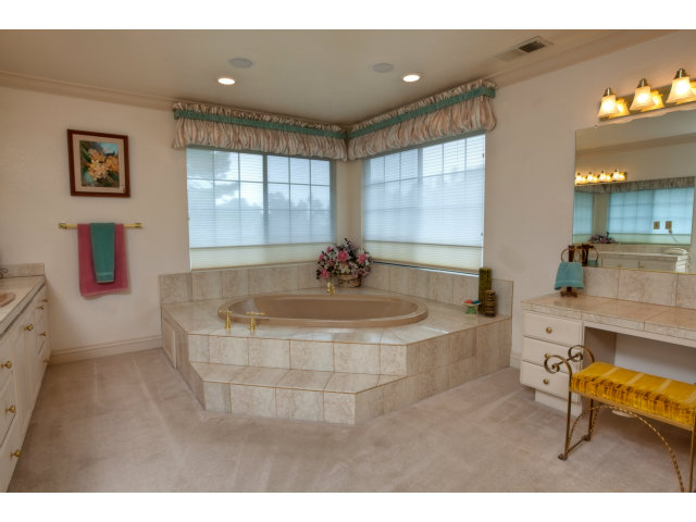 1151 Sunshine Valley Road Montara, CA 94037 - Photo 16 of 23 a spacious bathroom with a tub sink and mirror