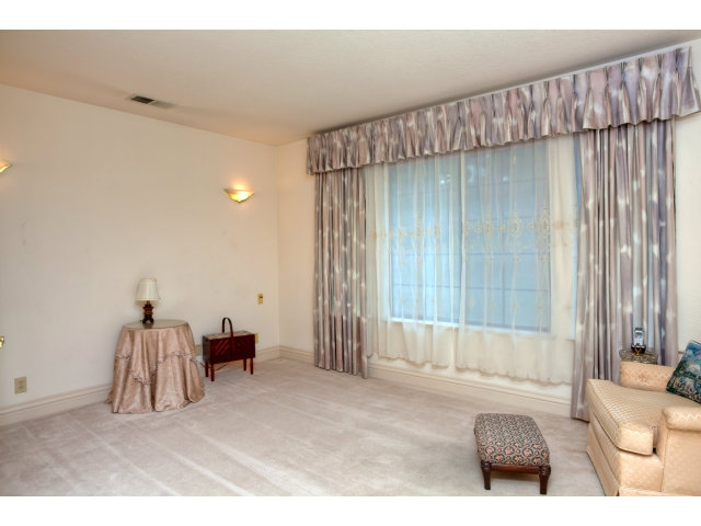 1151 Sunshine Valley Road Montara, CA 94037 - Photo 17 of 23 a living room with furniture and a large window