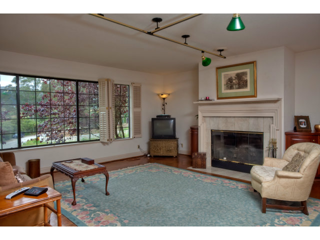 1151 Sunshine Valley Road Montara, CA 94037 - Photo 7 of 23 a living room with furniture and a fireplace