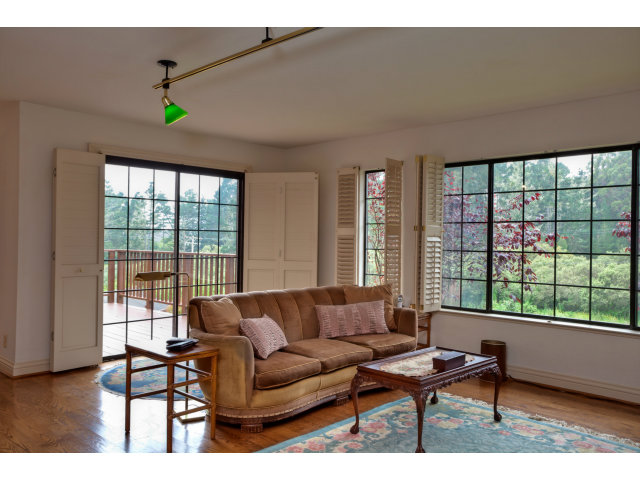 1151 Sunshine Valley Road Montara, CA 94037 - Photo 8 of 23 a living room with furniture and a window