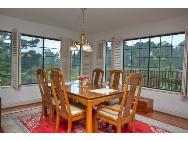 1151 Sunshine Valley Road Montara, CA 94037 - Photo 9 of 23 a view of a dining room with furniture wooden floor and chandelier