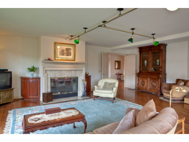 1151 Sunshine Valley Road Montara, CA 94037 - Photo 10 of 23 a living room with furniture and a fireplace