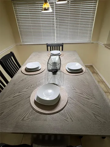 a kitchen with a sink a stove and cabinets