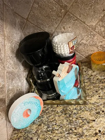 a view of a bedroom with furniture and wooden floor