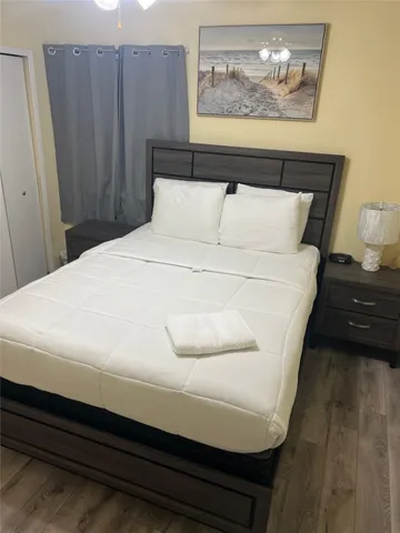 a spacious bedroom with a bed and a couch